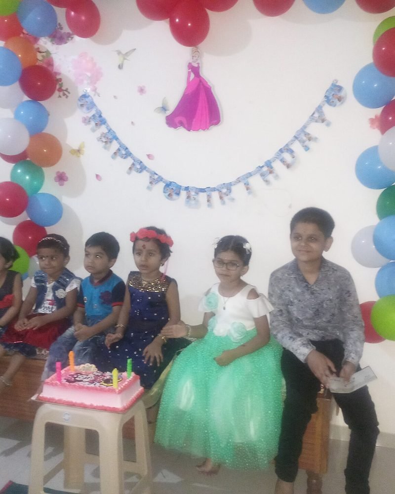 Birthday celebration with guests and cake